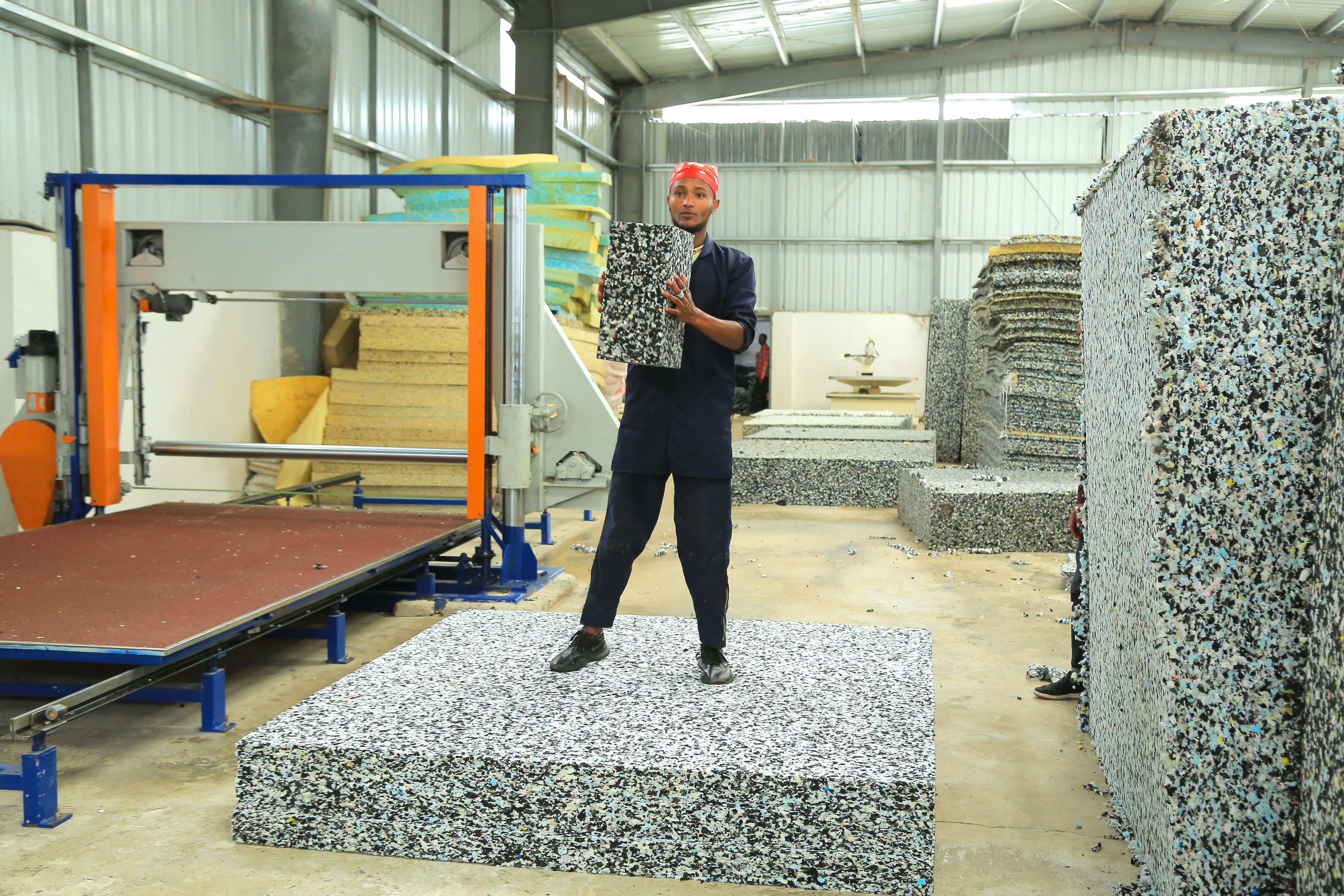 A team member demonstrating the strength of our bonded foam.